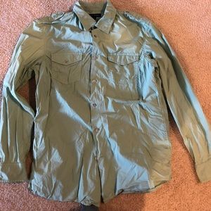 Green causal button down shirt.